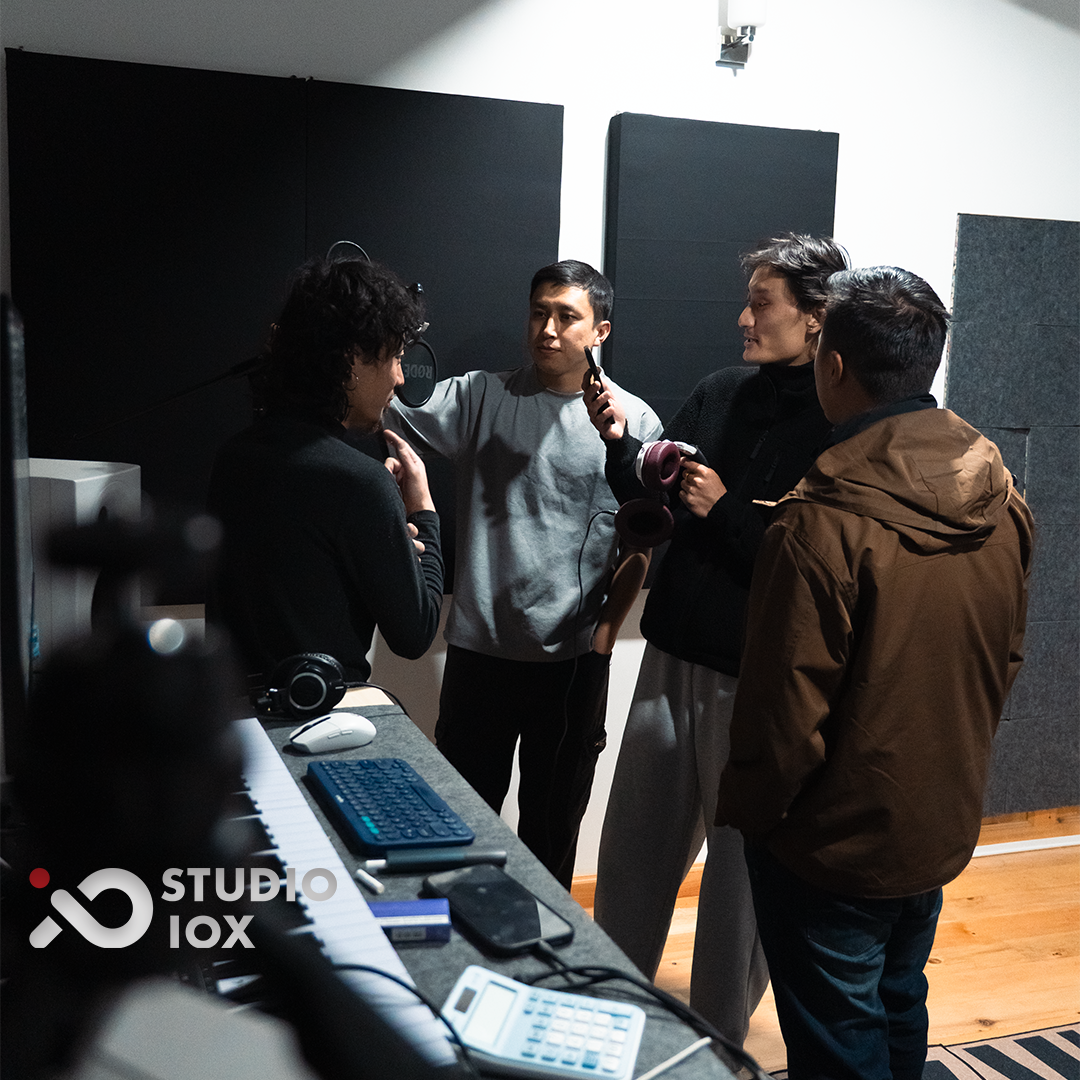 Studio IOX recording room session with headphones and vocal microphone